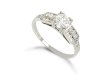 Diamond flanked solitaire ring, American, circa 1940.