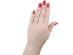 Diamond flanked solitaire ring, American, circa 1940.