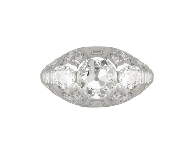 Ornate three stone diamond cluster ring, circa 1930.