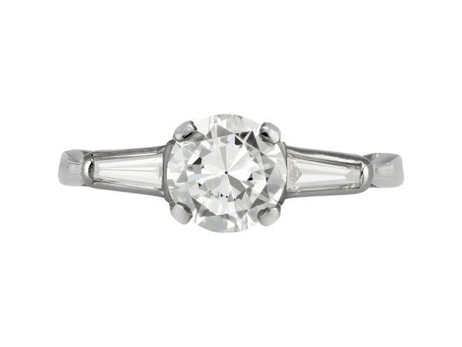 Diamond flanked solitaire ring, American, circa 1950.