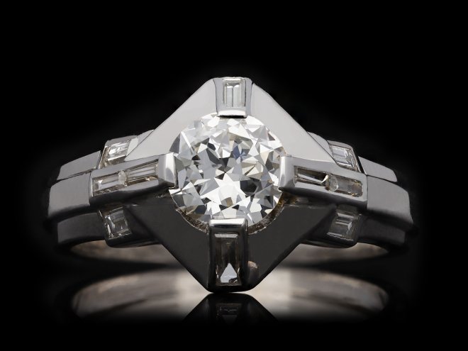 Flanked solitaire diamond ring, circa 1950. Hatton Garden