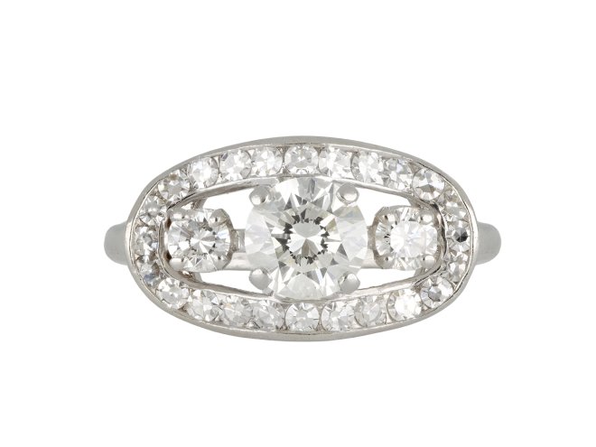 Three stone diamond cluster ring, circa 1950.