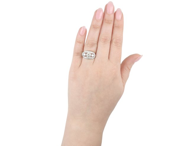 Three stone diamond cluster ring, circa 1950.