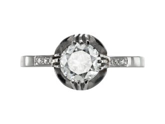 Diamond flanked solitaire ring, circa 1915.