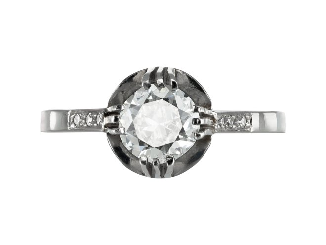Diamond flanked solitaire ring, circa 1915.
