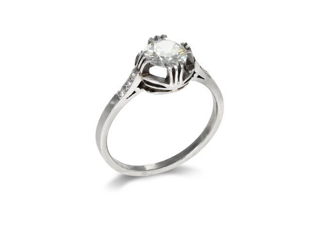 Diamond flanked solitaire ring, circa 1915.