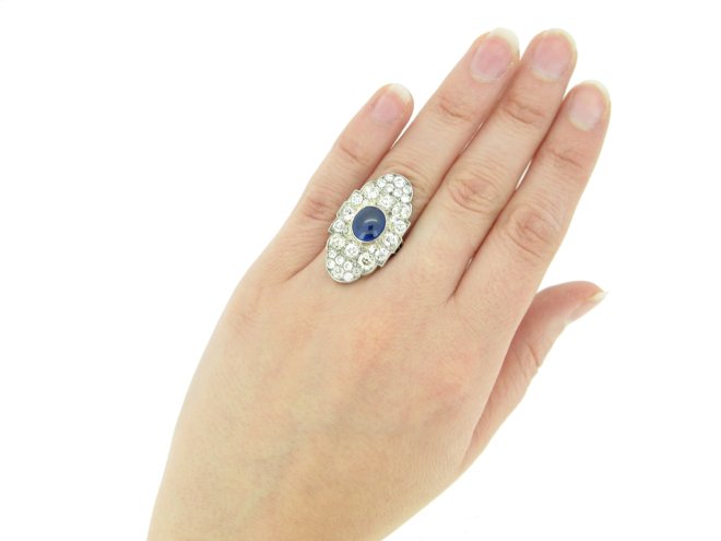 hand view Cabochon Burmese sapphire and old cut diamond cluster ring