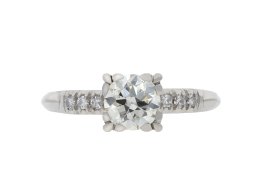 Flanked solitaire diamond ring, circa 1950.
