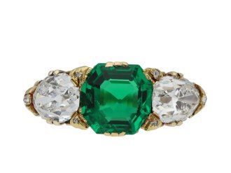 Antique emerald and diamond carved three stone ring hatton garden