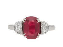 Ruby and diamond three stone ring, circa 1990. Hatton Garden