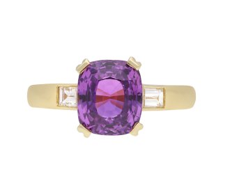 Purple sapphire and diamond flank solitaire ring, circa 1980. Hatton Garden