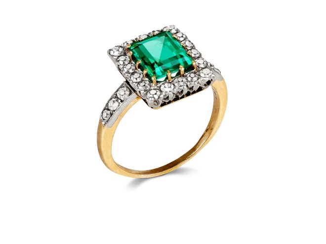 Antique emerald and diamond coronet cluster ring, early 20th Century. 
