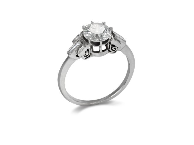 Art Deco diamond flanked solitaire ring, circa 1930.