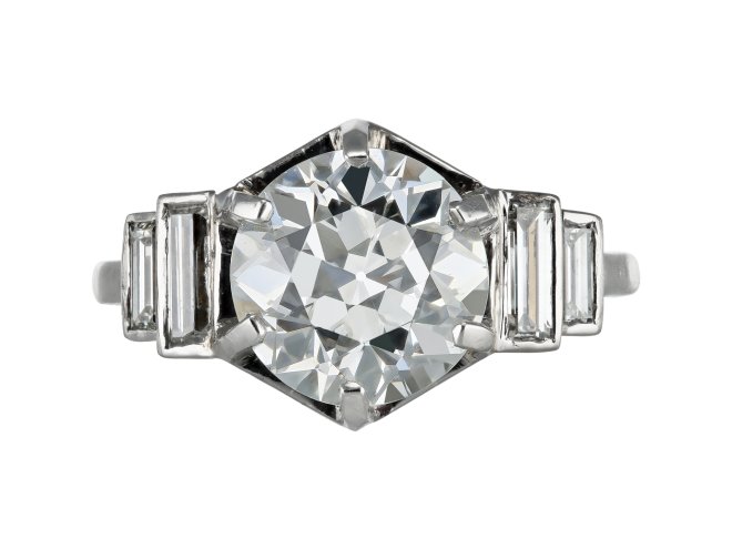 Solitaire diamond engagement ring with diamond set shoulders, French, circa 1930.