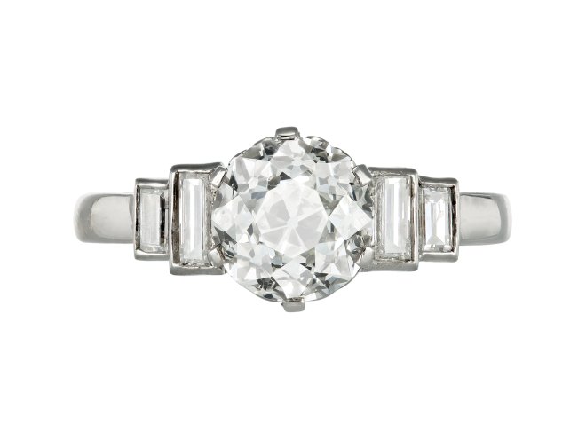 Art Deco diamond flanked solitaire ring, circa 1935.