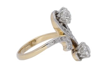 Art Nouveau diamond two stone cross over ring, circa 1905.     