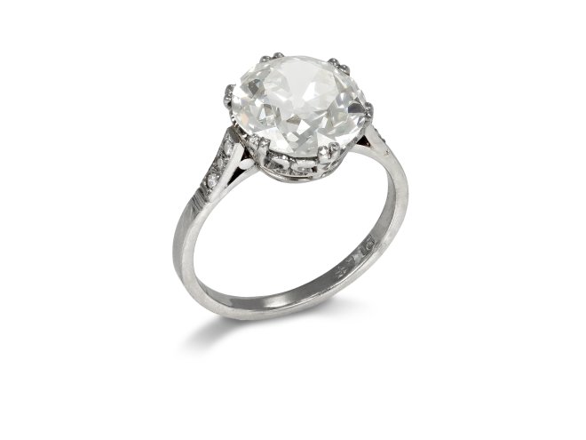 4.01 carat old cut diamond flanked solitaire ring, English, circa 1920. 
