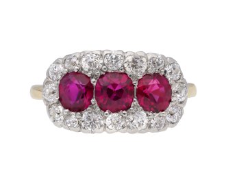 Edwardian Burmese ruby triple cluster ring, English, circa 1910.