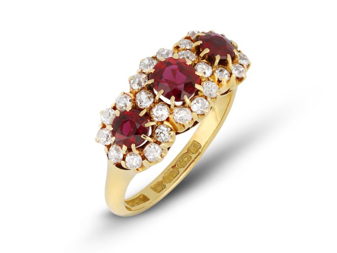Edwardian ruby and diamond triple cluster ring, English, circa 1905.