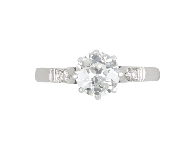 Old cut diamond flanked solitaire ring, English, circa 1935.