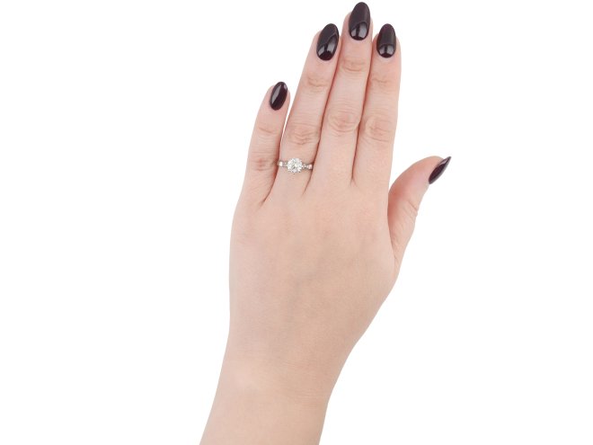 Old cut diamond flanked solitaire ring, English, circa 1935.