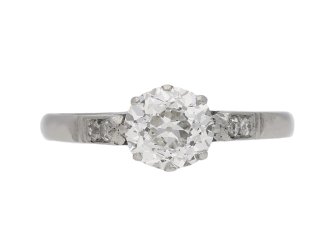 Old cut diamond flanked solitaire ring, English, circa 1935.