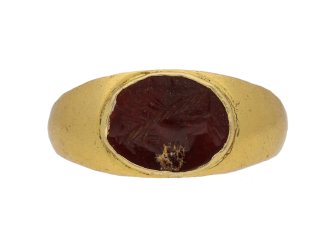 Ancient Roman Sol Invictus glass intaglio ring, circa 3rd-4th century AD. 