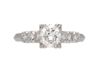 Diamond flanked solitaire ring, American, circa 1950.