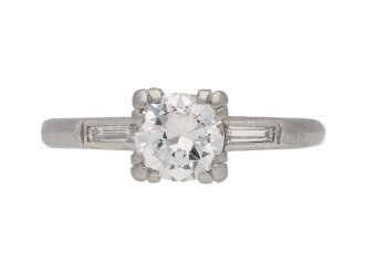 Diamond flanked solitaire engagement ring, English, circa 1950.