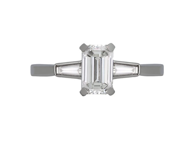  Emerald cut Diamond Flanked Solitaire Ring, circa 1950.