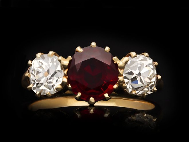 Pigeon's blood Burmese ruby and diamond three stone ring, circa 1900. Hatton Garden