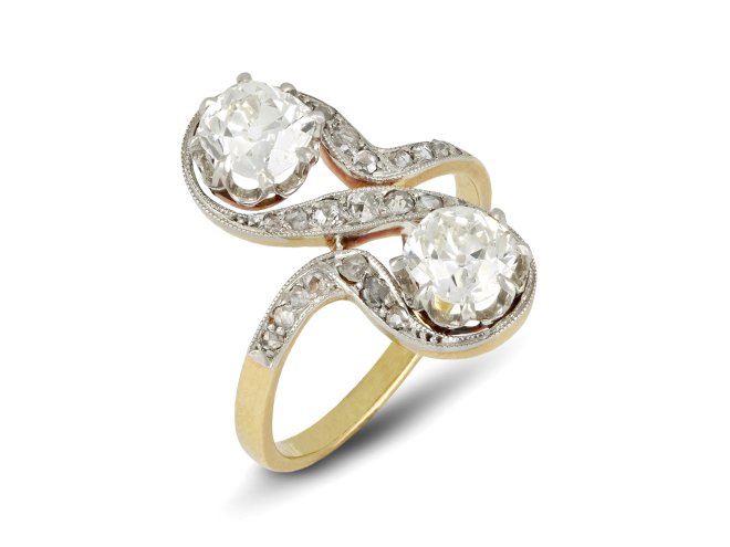 Belle Époque diamond two stone crossover ring, French, circa 1905. 