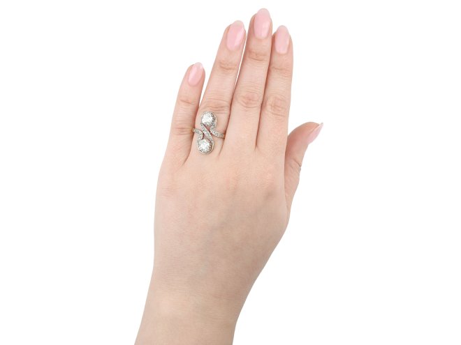 Belle Époque diamond two stone crossover ring, French, circa 1905. 