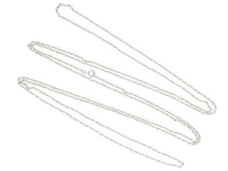 Natural pearl and platinum long guard chain, circa 1920.