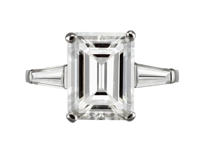 4.02 carat emerald cut diamond flanked solitaire ring, circa 1960.