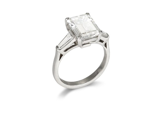 4.02 carat emerald cut diamond flanked solitaire ring, circa 1960.