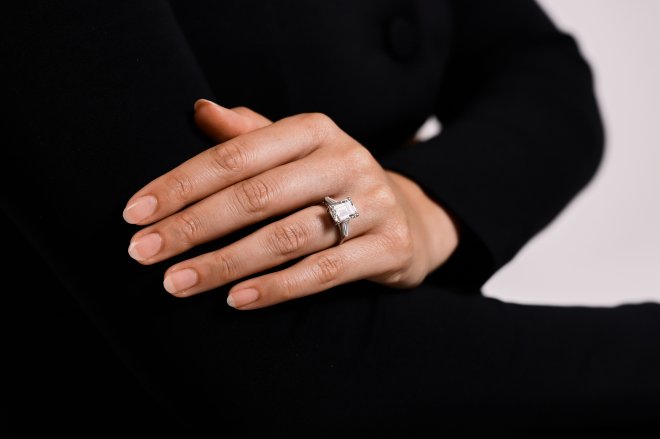 4.02 carat emerald cut diamond flanked solitaire ring, circa 1960.