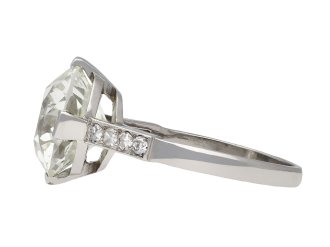 Diamond flanked solitaire ring, French, circa 1950. Hatton Garden