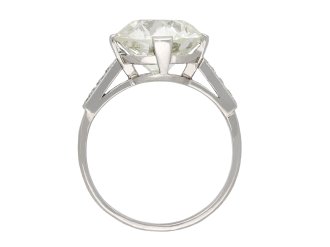 Diamond flanked solitaire ring, French, circa 1950. Hatton Garden