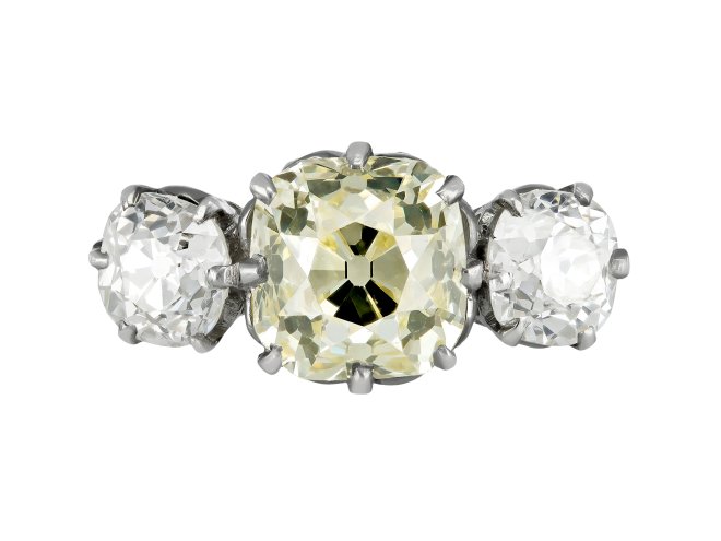 Edwardian fancy light yellow diamond three stone ring, English, circa 1910.