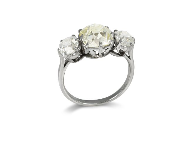Edwardian fancy light yellow diamond three stone ring, English, circa 1910.