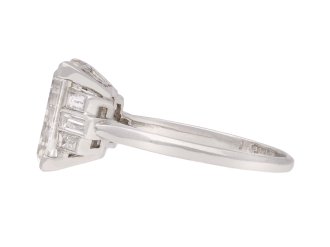 Art Deco flanked solitaire step cut diamond ring, circa 1925. Hatton Garden