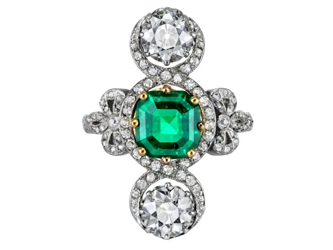 Edwardian Colombian emerald and diamond crossover ring, circa 1915.