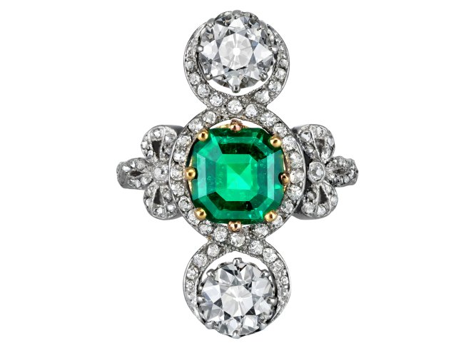 Edwardian Colombian emerald and diamond crossover ring, circa 1915.