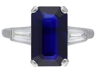 Sapphire and diamond flanked solitaire ring, English. 