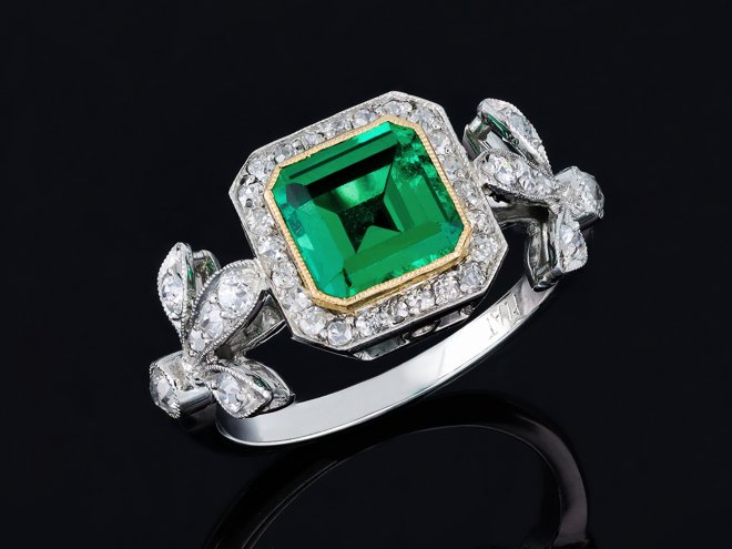 Colombian emerald and diamond cluster ring. hatton garden