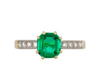 Colombian emerald diamond flanked solitaire ring hatton garden