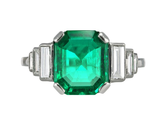 Art Deco Colombian emerald and diamond flanked solitaire ring, circa 1925.