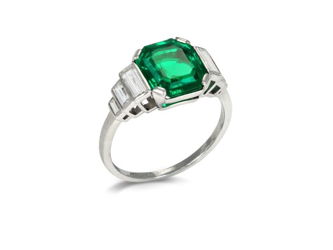 Art Deco Colombian emerald and diamond flanked solitaire ring, circa 1925.