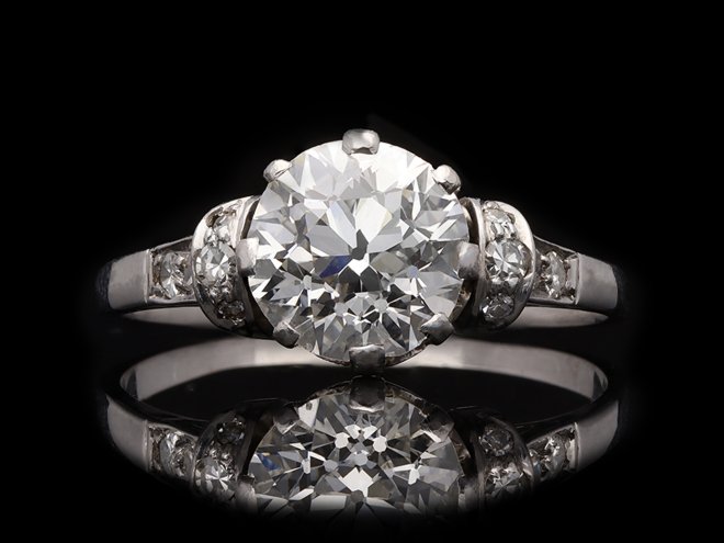 Old cut diamond flanked solitaire ring, circa 1920.  Hatton Garden